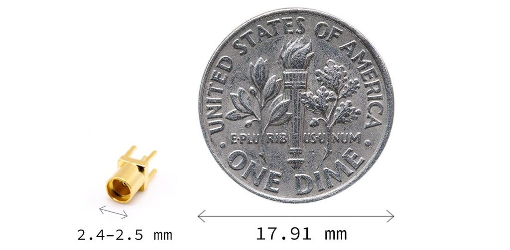 Close-up photographic comparison of an MMCX jack connector alongside a standard US dime to illustrate size scale