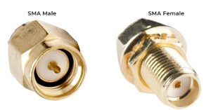 Close-up of a gold-plated SMA male RF connector on the left and an SMA female RF connector on the right.